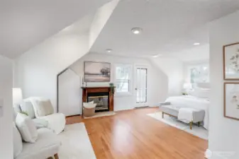 Enjoy the luxury of space and light in the primary bedroom, complete with a fireplace