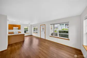 Expansive walls of windows bathe the home in natural light, each complemented by custom blinds for effortless privacy.