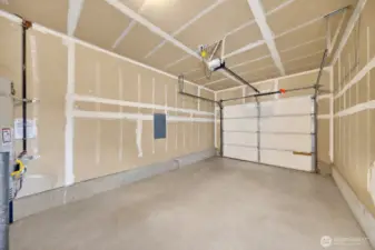 A finished garage is a step away from the utility room.