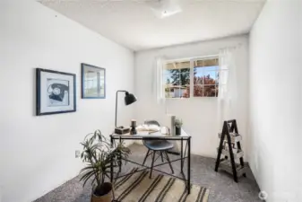 The second guest bedroom can also be used as a home office. It also looks out over the front yard.