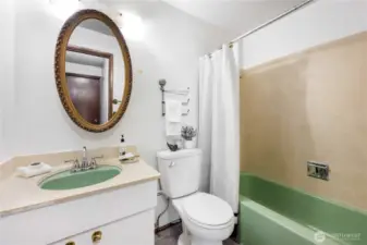 This full bath serves the entire main level of the home.
