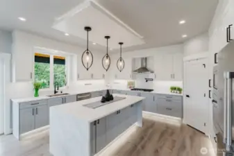 Large kitchen with waterfall quartz countertops