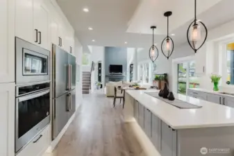 True chefs kitchen includes wall oven and double fridge freezer.