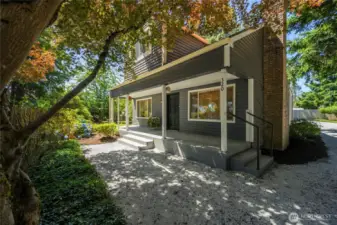 Charming curb appeal with fresh exterior paint, mature landscaping, and a welcoming front porch.