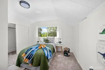 Another inviting upstairs bedroom with soft carpeting and playful charm, feels like a cozy treehouse retreat.