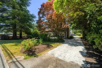 Lovely, mature landscaping welcomes you home!