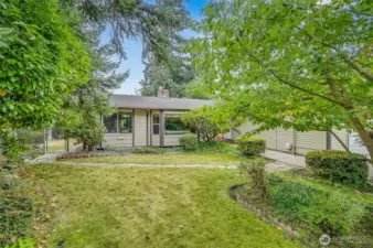 Bayed Living Room window gives you a perch to watch over the cul-de-sac. Stone pathway leads you through the lovingly maintained front yard to the gorgeous backyard.