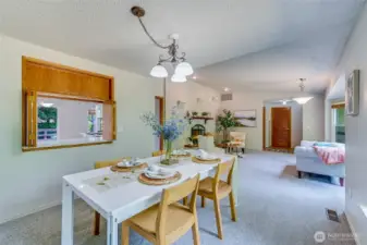 Another view from the Dining Room toward the Living Room. Reminder, this home has fresh paint and new carpet throughout!