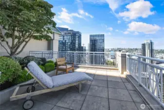 ooftop terrace of the Cosmopolitan in Seattle, offering an impressive vantage point of the city and waterfront.
