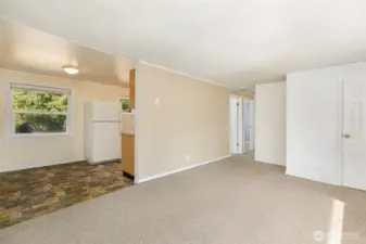 Living room is open to dining & kitchen areas