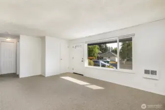 View from dining to entry & hallway to bedrooms