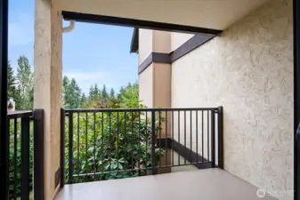 Balcony off the primary suite. Wooded, quiet & private