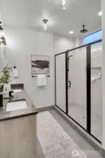 features a wide shower with rain shower and hand spray arm.