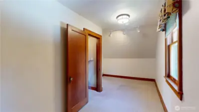 This is the den on the second floor and could be used as a guest suite. this photo is taken from the closet area looking towards doorway