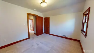 Second of two bedrooms upstairs looking towards doorway.  Closet is just off to the right of the door