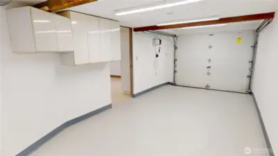 Finished 1-car garage looking towards downstairs family room