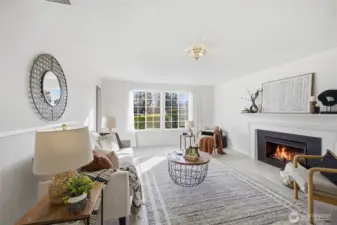 The second living room features a cozy fireplace, providing a warm and inviting atmosphere perfect for relaxing or entertaining.