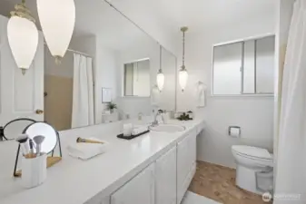 Full upstairs bathroom featuring vintage chandeliers.