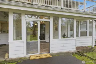 Access to the sun room and inside of the home through the sliding doors.