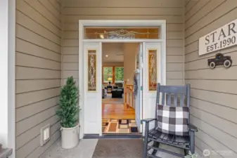 Covered front porch entry to greet your guests. Step inside to an open foyer with a memorable millwork package.