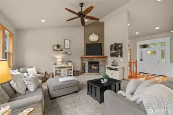 Great room with wood burning fireplace.