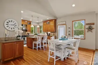 Kitchen table dining space. Back deck access. Door with internal blind. Lot's of natural light. Hardwood floor inlay is beautiful and memorable.