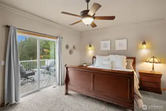 Primary bedroom with ceiling fan.