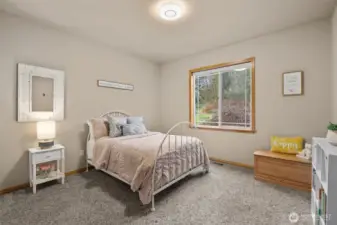 Upper level bedroom adjacent to a 3/4 bathroom.