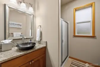 Stylish 3/4 bath on the upper level adjacent to a bedroom.