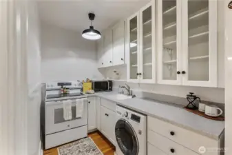 Remodeled kitchen includes a washer/dryer unit