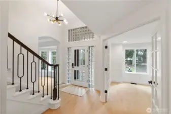 Main floor den with French doors looking out onto front yard. Great Home office or extra bedroom.