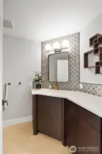 Updated main floor powder room with large vanity.