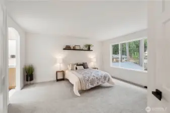 Primary bedroom has new carpet/paint, walk-in closet and updated primary bathroom.