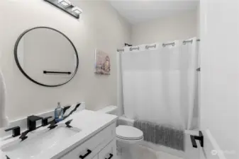 A full bath is conveniently located between both lower level guest bedrooms
