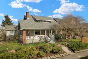 This 1918 Craftsman is situated on a corner lot with beautiful landscaping.