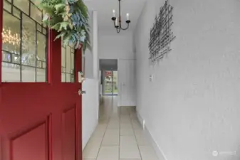 As you step in, you are greeted by the newer custom tile flooring and bright new paint.