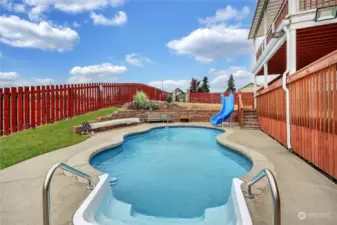 Can you BELIEVE this POOL?!?  It comes with a cover and a slide. The water feature toward the front of the pool is a nice addition.