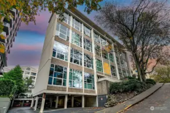 This 65-unit, classic mid-century building blends concrete and steel construction with modern conveniences. Enter with electronic fob and enjoy access to an elevator, gym, sauna, storage, and laundry. Pet-friendly and rental-friendly (after one year of ownership). Affordable parking is available across the street, and reasonable monthly dues are just $475, with no outstanding HOA assessments.