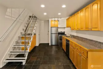 Bathed in radiant natural light from an expansive floor-to-ceiling wall of high-efficiency southwest-facing windows, this one-bedroom loft condominium invites you to revel in an airy, open design with a breathtaking 14-foot ceiling. A unique city treasure, it offers an elevated view over a lush embankment of mature maples, infusing every moment with tranquility. Perched above a quiet street, it feels like a hidden sanctuary, yet places you effortlessly within reach of urban vibrancy. Whether as your personal retreat, a full-time city base, or a coveted rental, this Talisman loft merges sophisticated style, comfort, and an irresistible touch of nature—your own urban haven.