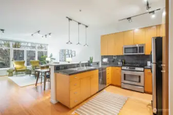 Chef's kitchen with beautiful cabinets and counters.