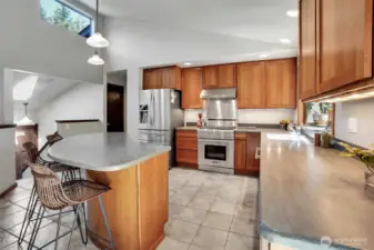 Custom Cherry Cabinets and a fabulous Kitchen Island draws family ad friends to the kitchen.