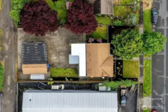 Aerial view of Main House and Detached garage. Large lot. Ample parking. 2 roads access front and back.