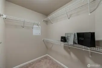 Master’s walk-in closet with prewired panel for internet and security.