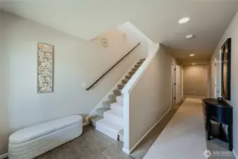 Extra wide stairs with wood railing as you head upstairs to main living area with views. Entry level has 3 sizable bedrooms and a full bathroom. Entry level is not a basement. Light-filled and excellent ceiling height.