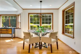 Elegant dining room with stunning views of the sprawling, sunlit grounds.
