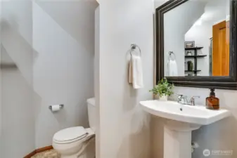 Sleek main-floor 3/4 bathroom with modern elegance and convenience.