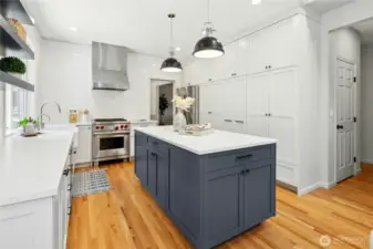 The kitchen has a great prep island and ample pantry storage. Plus a wonderful built-in coffee bar.