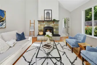 Back inside to the family room with tall vaulted ceilings. The entire home was just freshly painted.