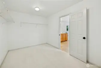 The walk-in closet in the primary suite. Wonderful storage space in here.