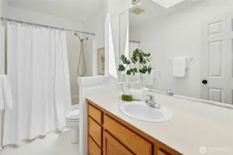 The main hallway bathroom upstairs with a tub and shower combo.